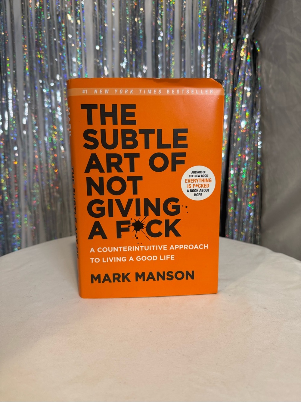 The Subtle Art of Not Giving a F*ck - Bright Orange Hardcover by Mark Manson